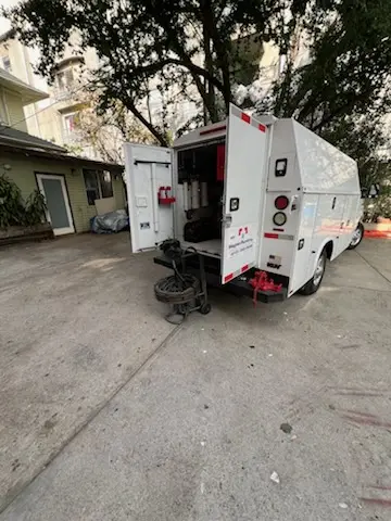 Magnet Plumbing service vehicle on-site for Grease Trap Cleaning in Boca Del Mar